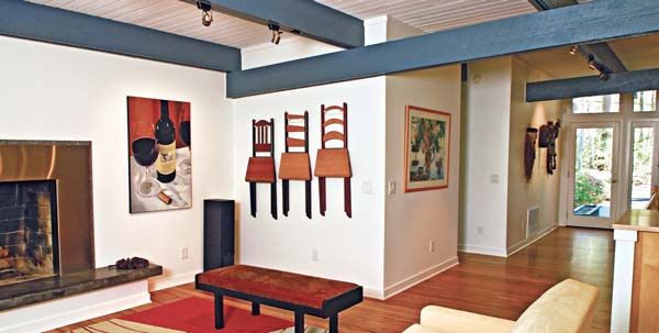 AFETR: These homeowners refinished the original wood floors with nontoxic materials and painted the walls and ceiling with white, low-VOC paint to reflect more natural light.